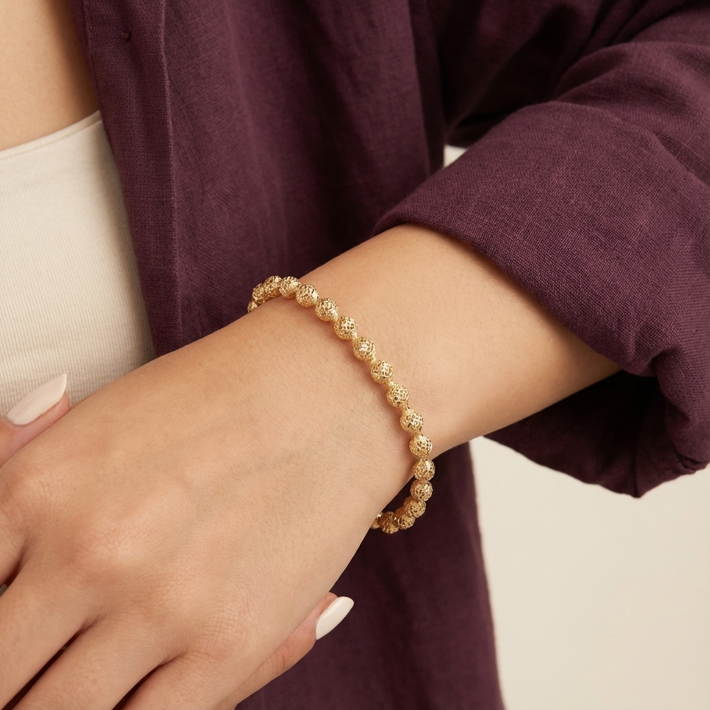 أسورة ذهب عيار 18 بتصميم كرة