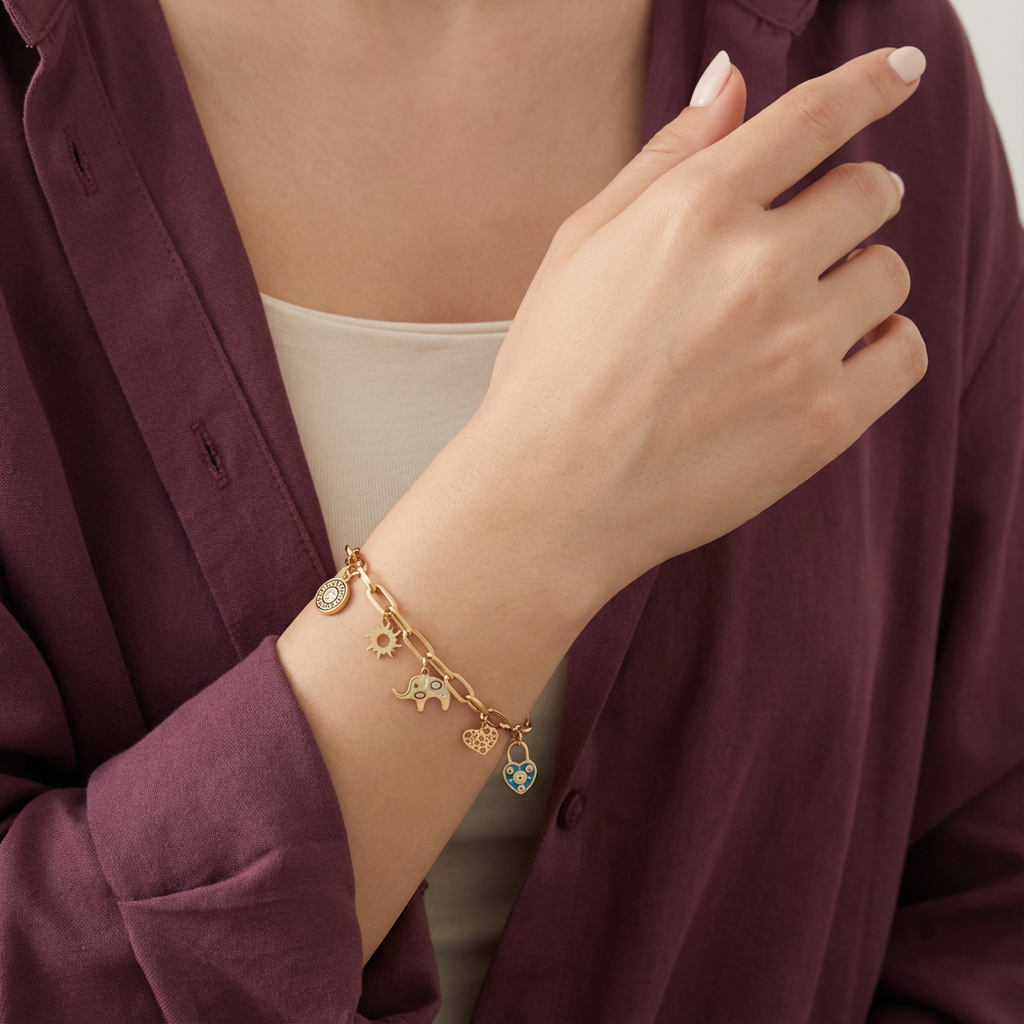 أسورة ذهب عيار 18 بتصميم تعليقات شمس وفيل